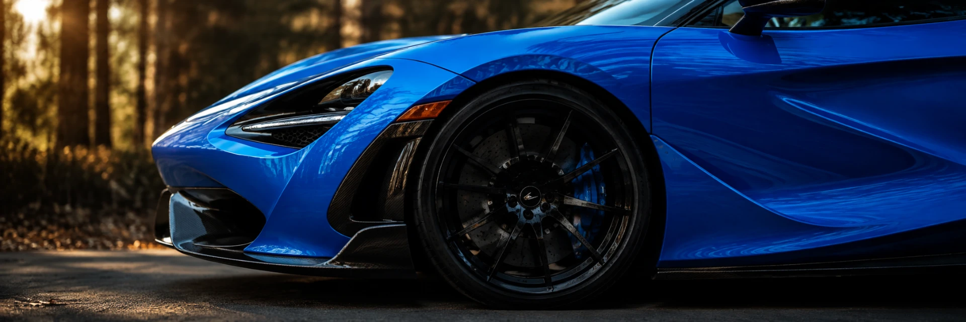 Blue McLaren supercar with a paint-corrected, ceramic coated finish after a detail by CustomsByAli