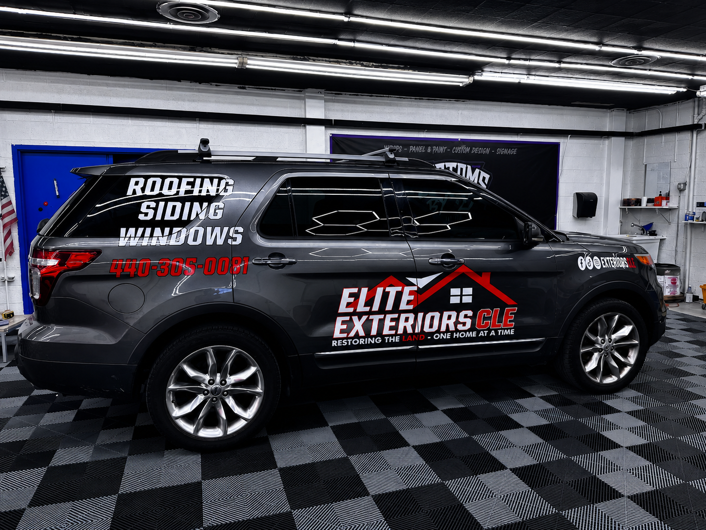 SUV with professional cut vinyl lettering and logo graphics for a roofing and siding contractor by CustomsByAli