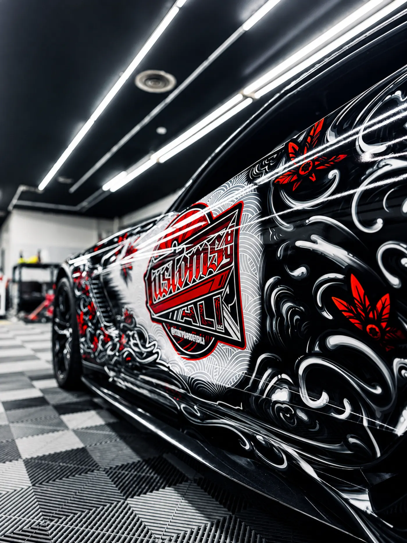 Custom wrapped Chevrolet Corvette with CustomsByAli branding and graphics in the Elyria, OH shop