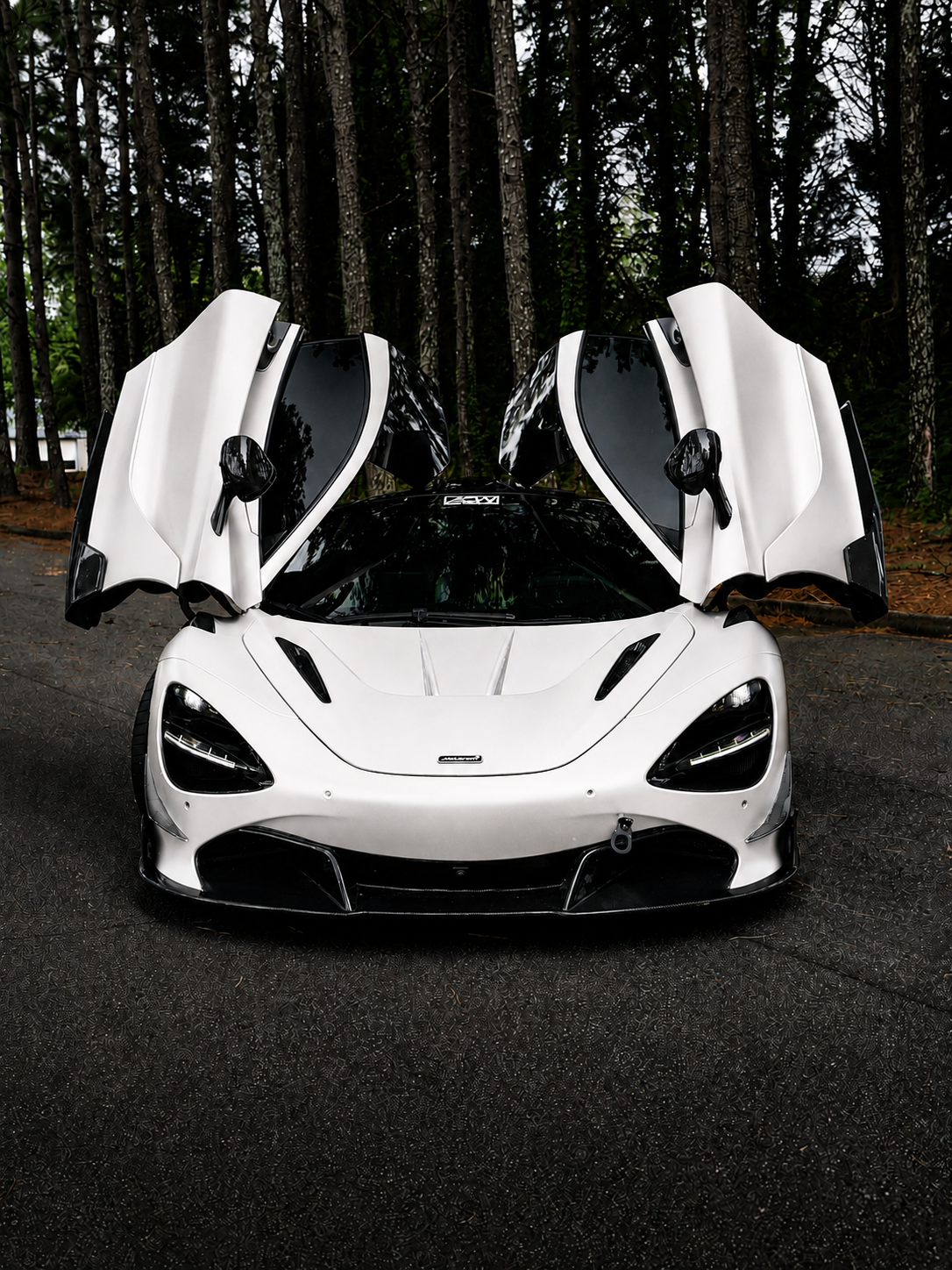 White McLaren 720S with butterfly doors open after a color change wrap by CustomsByAli in Elyria, OH