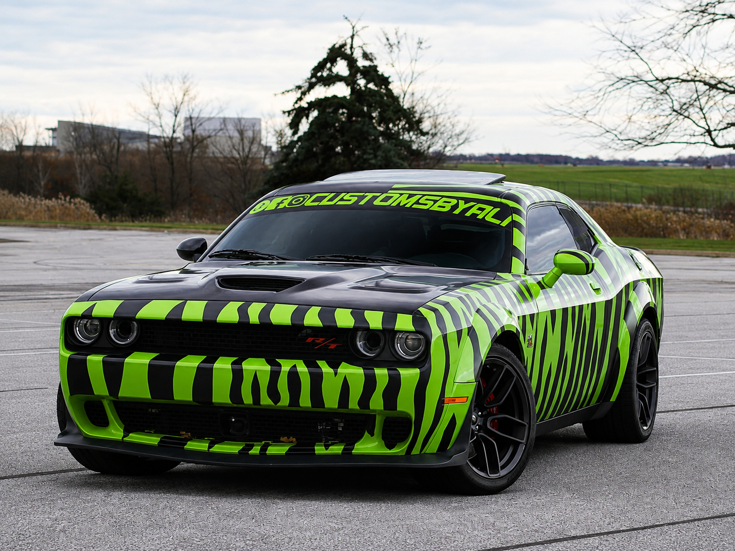 Dodge Challenger SRT with a bold green and black custom printed vinyl wrap by CustomsByAli in Elyria, OH