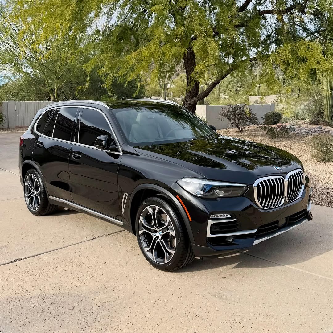 Dark BMW X5 SUV with fresh window tint and a sealed gloss finish in Cleveland, Ohio