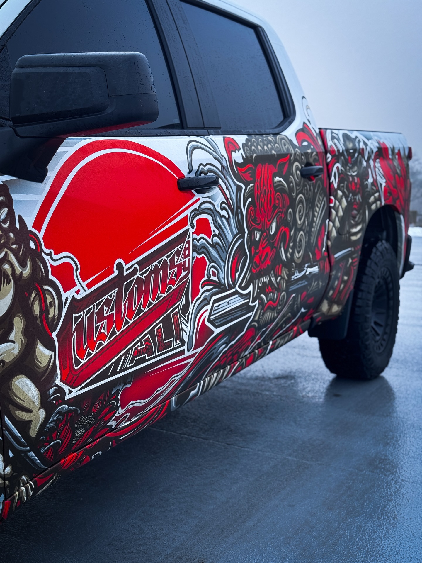 CustomsByAli pickup truck with a full custom printed red and white graphics wrap in Lorain, OH